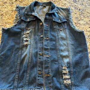 Men’s sleevless jean vest with Flatbush Zombies patch.